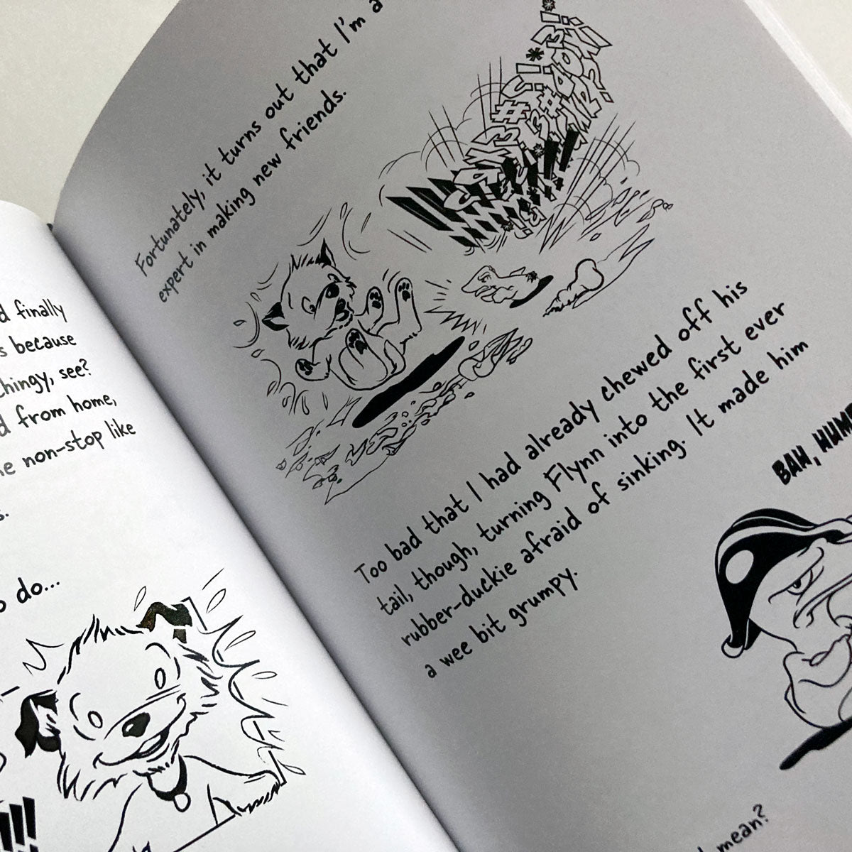 The Big World According to Little Hunterman - now as a beautiful premium print version on white paper (Hardcove & Paperback). The image shows an open book with white pages, text, and black-and-white illustrations.