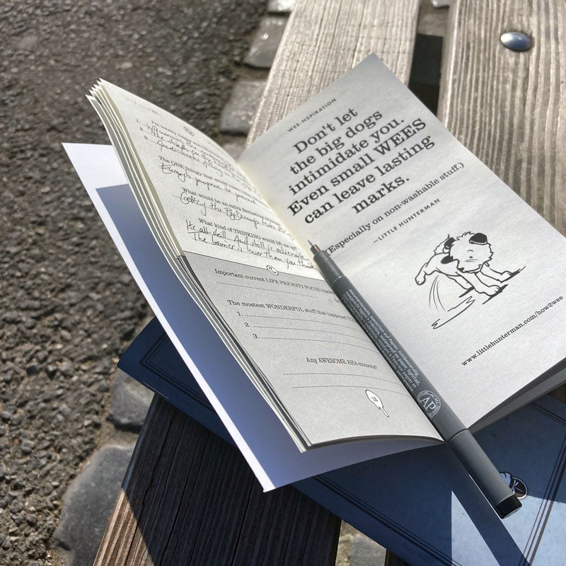 use case image with Hunterman's journals while on sitting on a bench