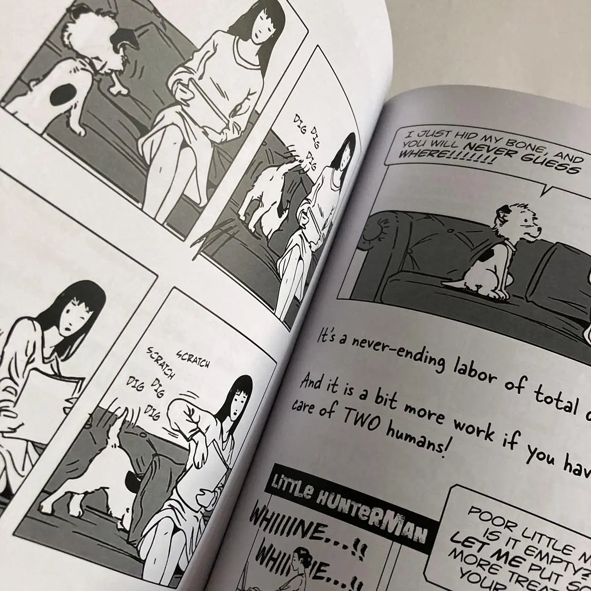 The Big World According to Little Hunterman by Hunter Lassal is a premium edition hardcover with black-and-white illustrations on white, coated paper. This image shows an open book against a light background, giving you an impression of this fun dog memoir's layout and illustration style.