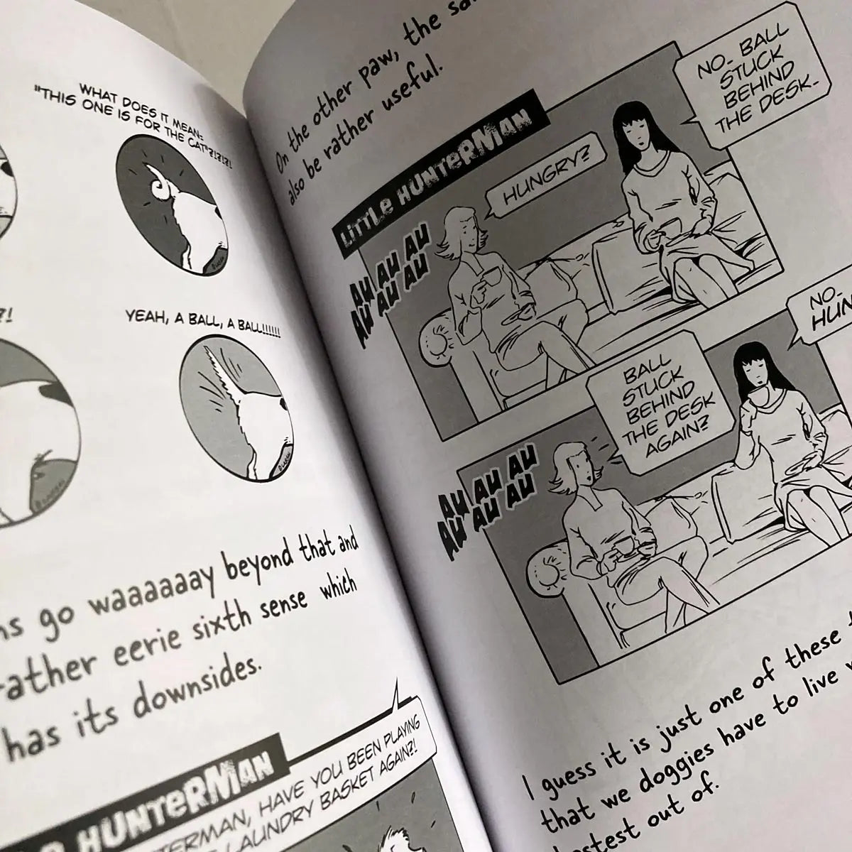 The Big World According to Little Hunterman by Hunter Lassal is a premium edition hardcover with black-and-white illustrations on white, coated paper. This image shows an open book against a light background, giving you an impression of this fun dog memoir's layout and illustration style.