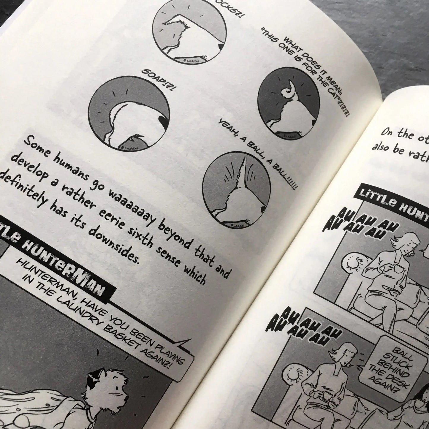 The Big World According to Little Hunterman, retailer version hardcover with black and white illustrations and creme colored paper. This images shows an open book on a table giving you a glimpse of the illustrated content pages.