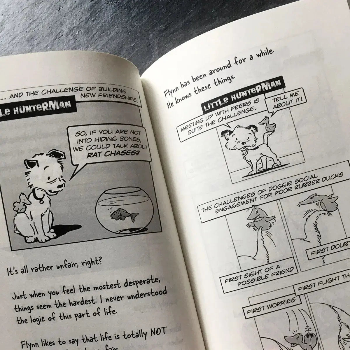 The Big World According to Little Hunterman, retailer version hardcover with black and white illustrations and creme colored paper. This images shows an open book on a table giving you a glimpse of the illustrated content pages.