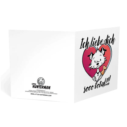 Front of square Little Hunterman card showing him and Flynn looking out of a big red heart with large text saying in German: Ich liebe dich sooo total!!! With the card  standing open on a white surface showing the front and back page.