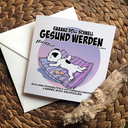 Little Hunterman's German Klein Huntermamms "ganz doll schnell gesund werden" Greeting Card. Square card, folded, closed on a table.