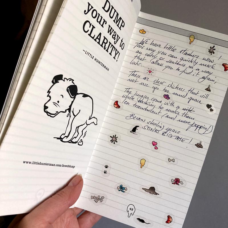 A sample page of Little Hunterman's Big Dump Journal, decorated with stickers from Sticker Sheets 1 and 2. It shows how having the stickers on clear material helps by not covering up the journal beyond the illustrations themselves. Meanwhile, the illustrations come with a white backing to let them pop out more on the page.
