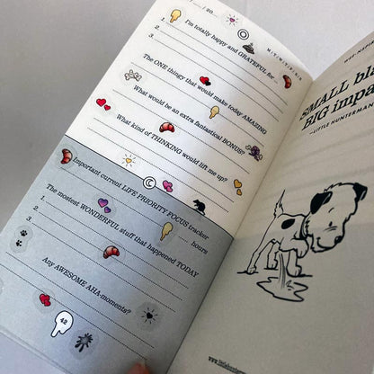 A sample page of Little Hunterman's Quick Wee Journal, decorated with stickers from Sticker Sheets 1 and 2. It shows how having the stickers on clear material helps by not covering up the journal beyond the illustrations themselves. Meanwhile, the illustrations come with a white backing to let them pop out more on the page.