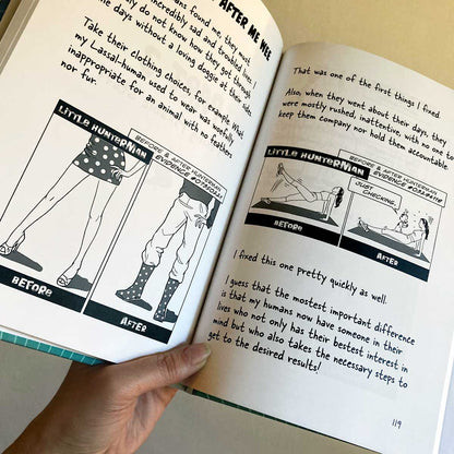The Big World According to Little Hunterman by Hunter Lassal, premium edition hardcover with black and white illustrations on white, coated paper. This image shows a hand holding an open book agains a light background, giving you an impression of the layout and illustration style.