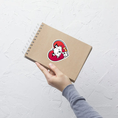 Image shows a hand holding a notepad with one of Little Hunterman's "Sticky Doggie Love" stickers glued to the front.