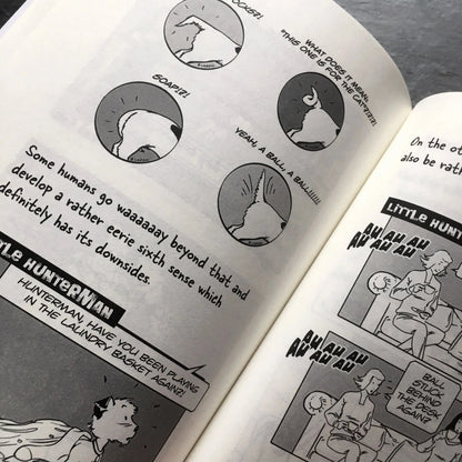 The Big World According to Little Hunterman, retailer version hardcover with black and white illustrations and creme colored paper. This images shows an open book on a table giving you a glimpse of the illustrated content pages.